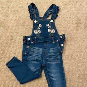 Seven embroidered overalls